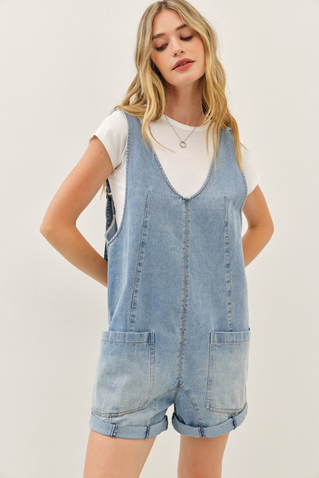 WASHED DENIM ROMPER WITH FRONT POCKETS